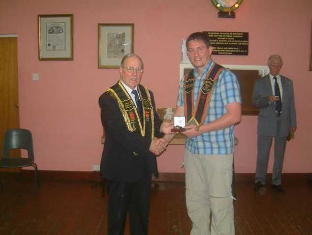 Outgoing WDM Sir Knt James Hewitt left being presented with a watch by Sir Knt Jonathan Russell RBP 1107